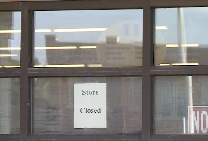 Store closed sign in the window
